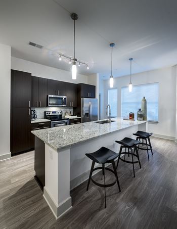 Granite and quartz countertops and stone backsplashes